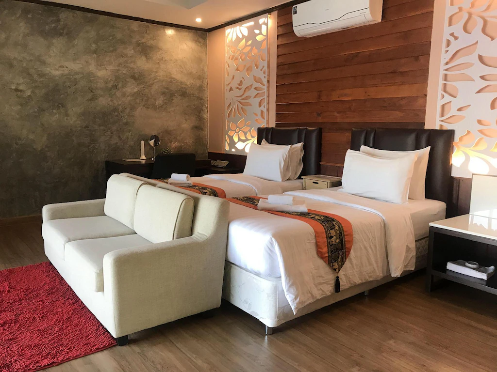 เตียงเดี่ยวของ Naga Tara Boutique Resort