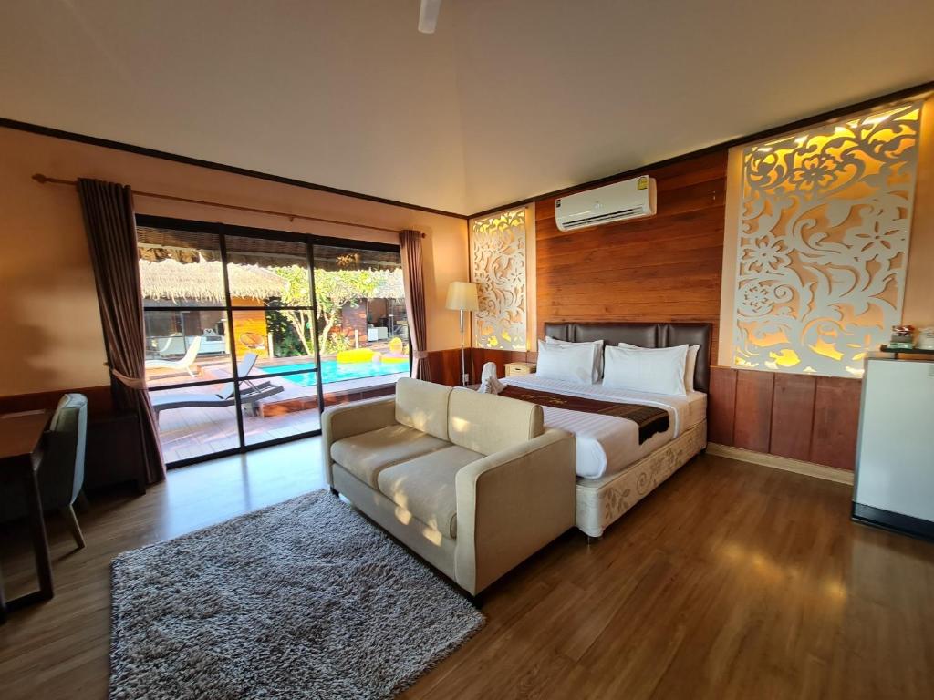 เตียงเดี่ยวของ Naga Tara Boutique Resort
