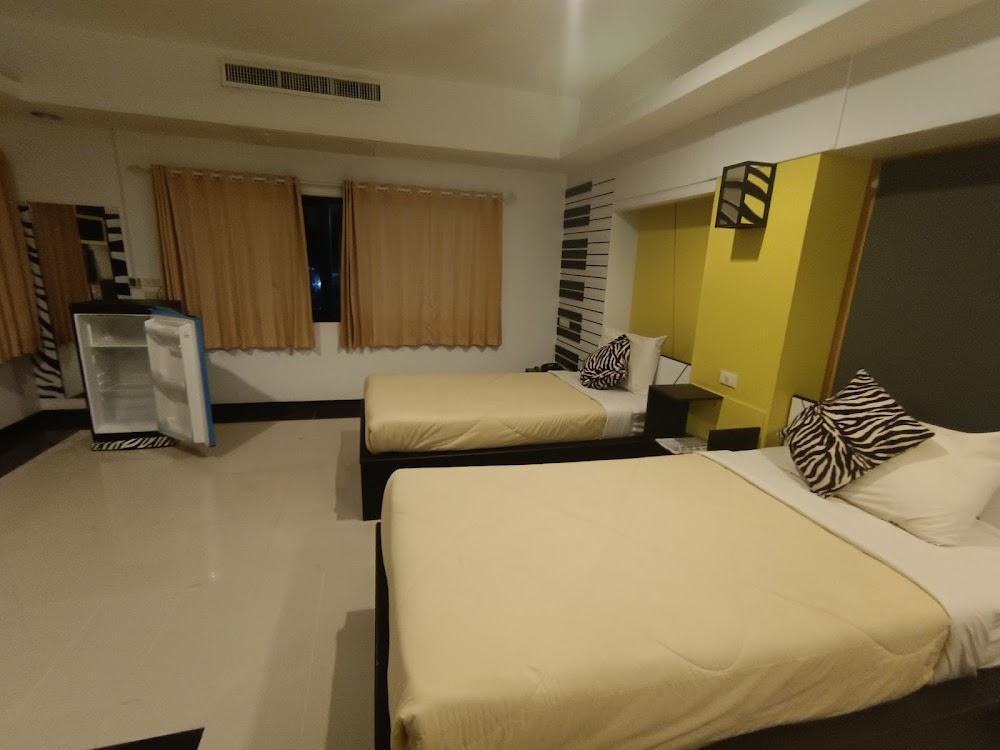 ภาพเตียงคู่ของโรงแรม Win Hotel พะเยา
